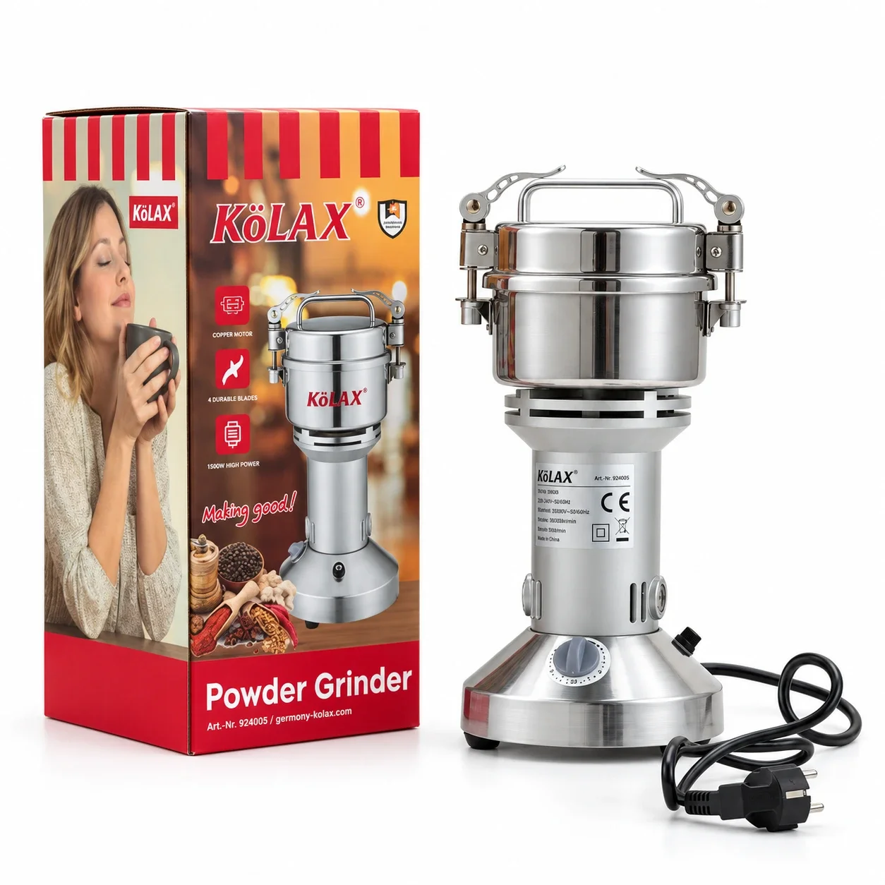 KöLAX powder grinder beside its red and gold retail packaging, with the power cord alongside.
