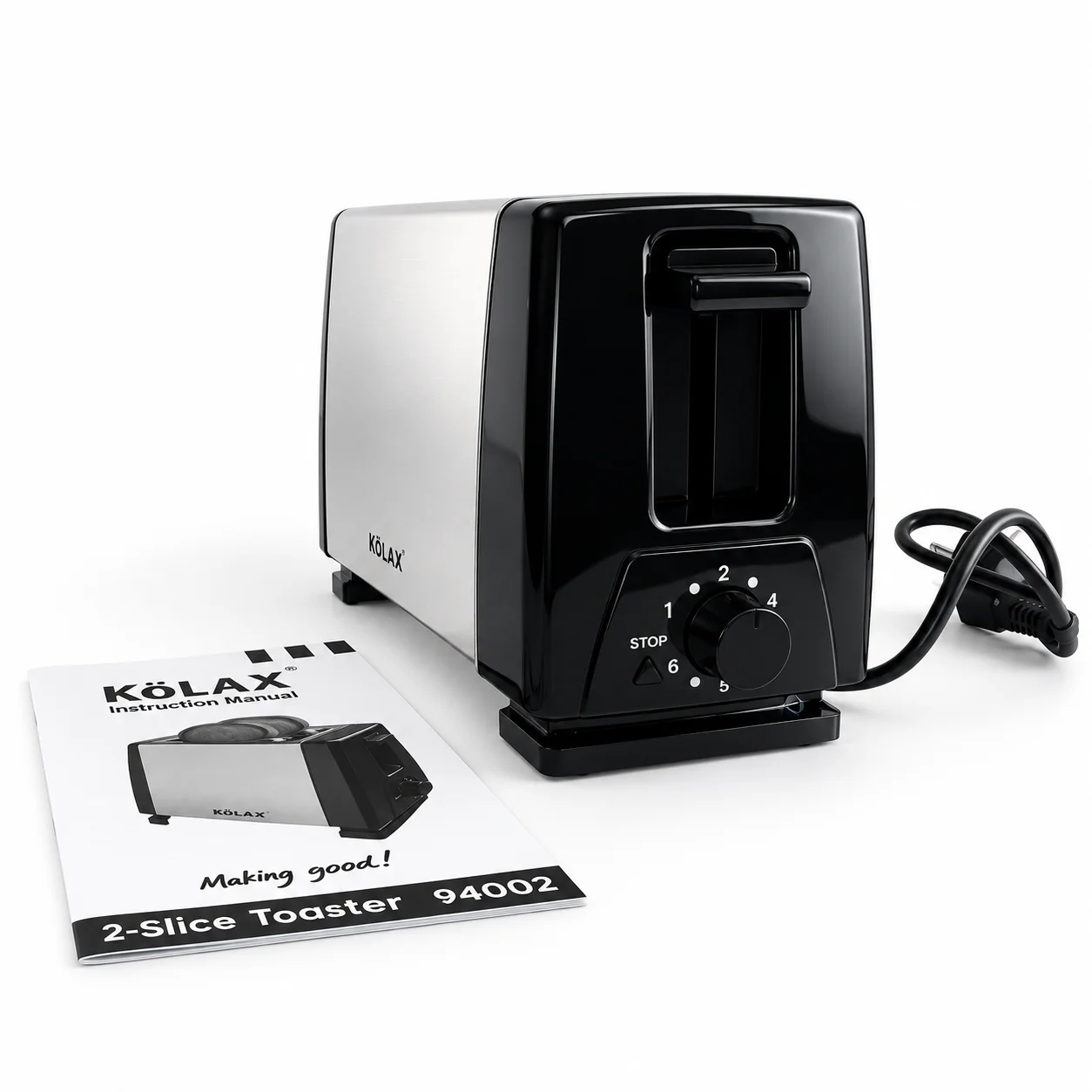 Side view of the KöLAX toaster showing the lever, browning dial and stop button, with its instruction manual alongside.
