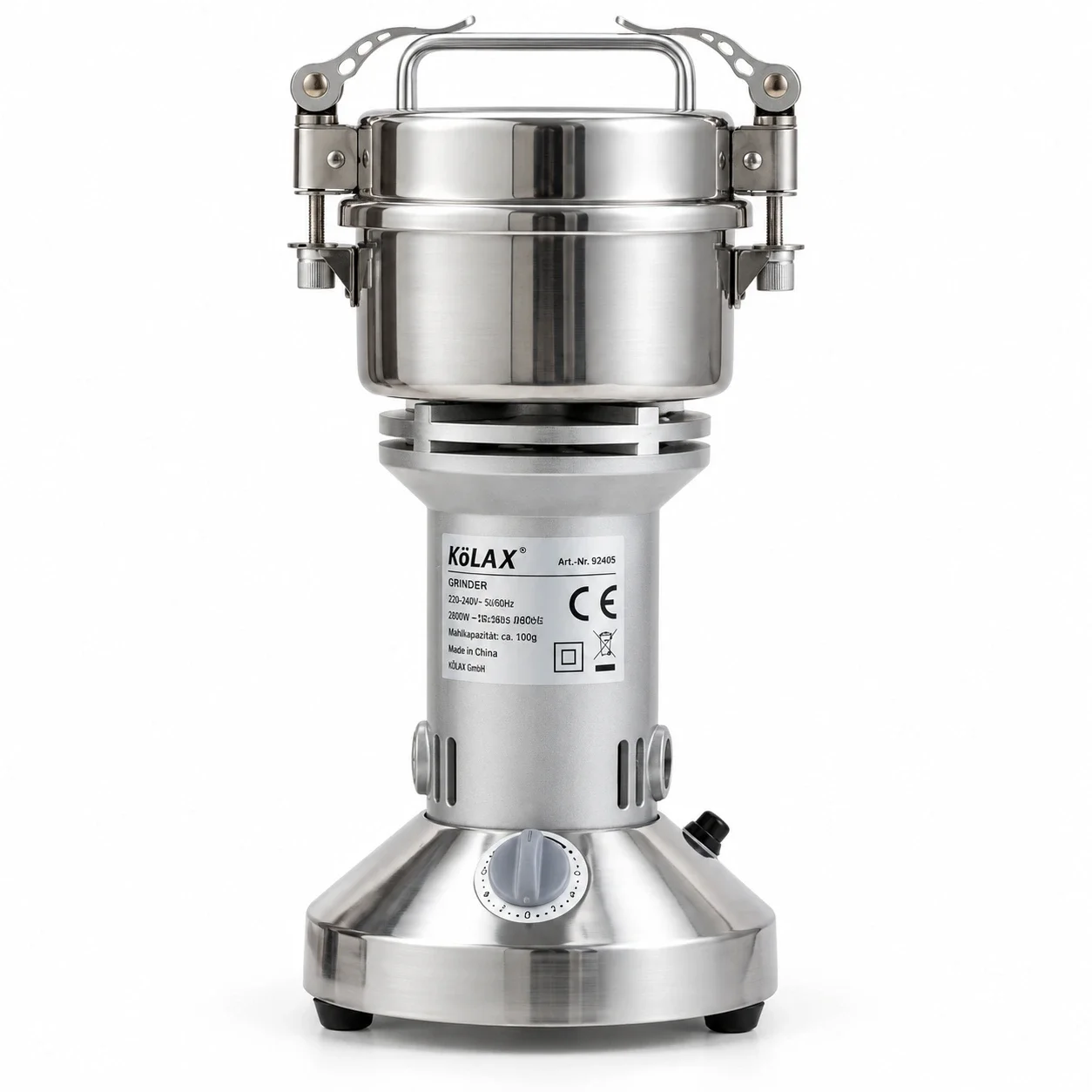 KöLAX stainless steel powder grinder with a clamped lid, carry handle and timer dial, shown on a white background.