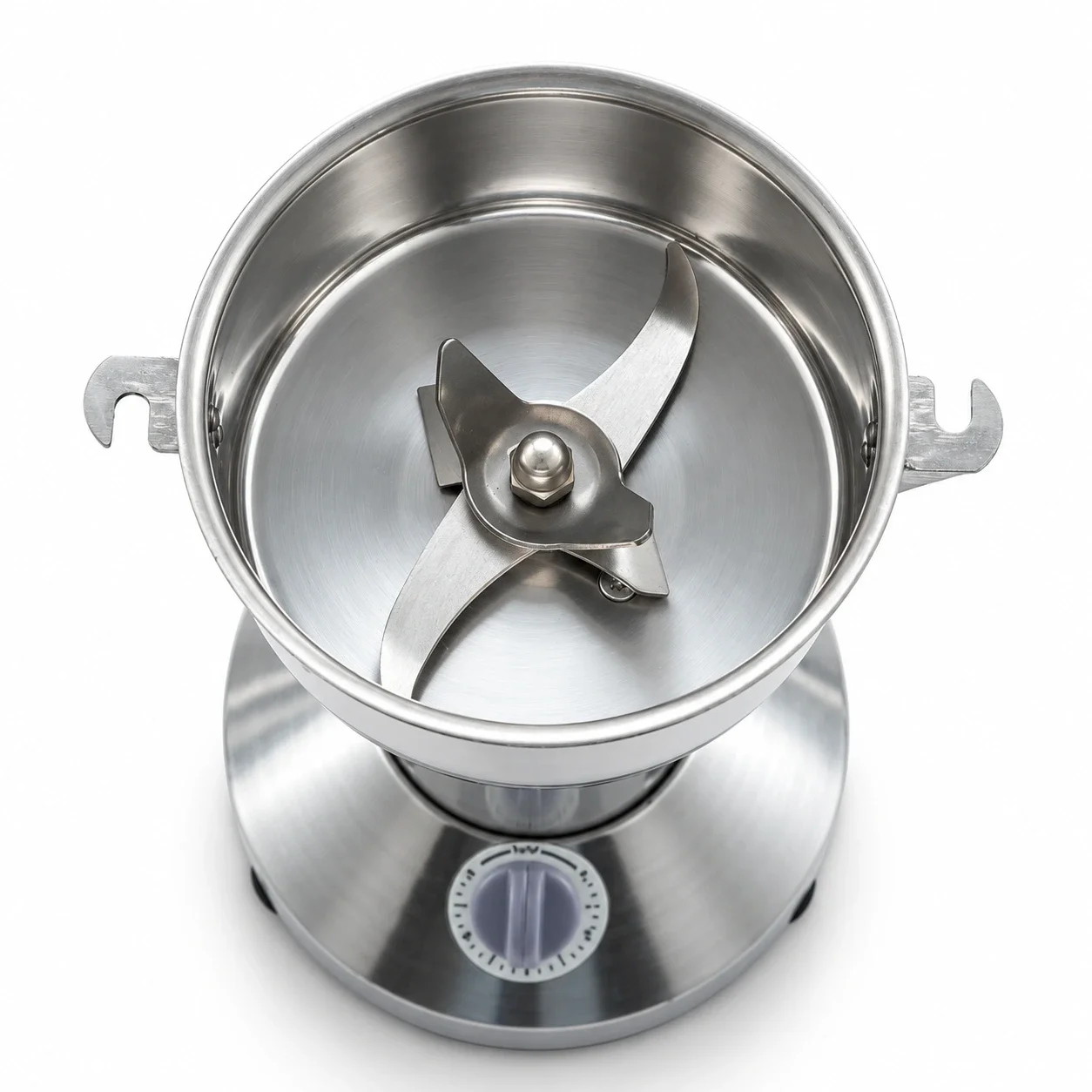Top view of the KöLAX powder grinder’s stainless steel grinding chamber and central blade assembly.